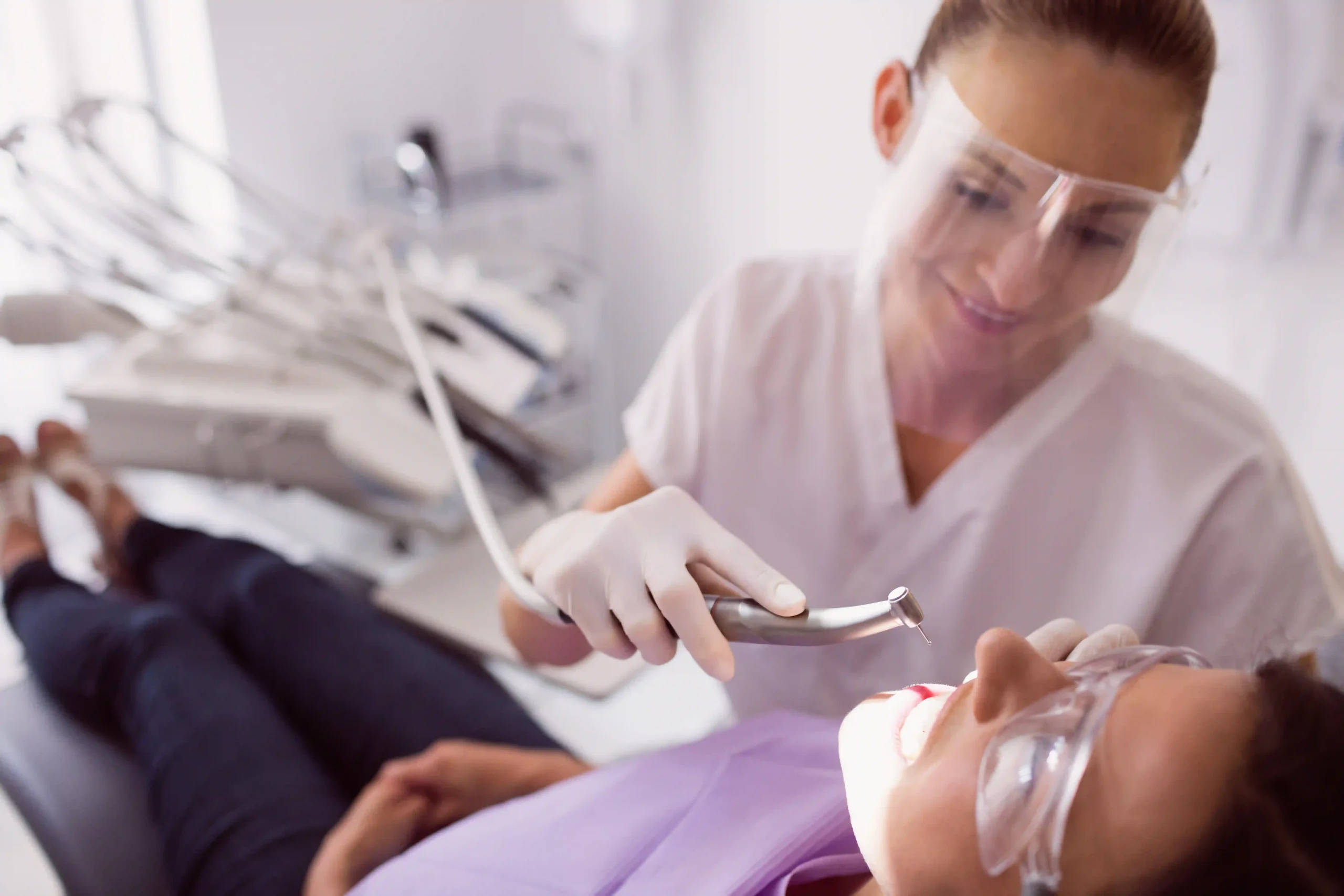 dentist-examining-female-patient